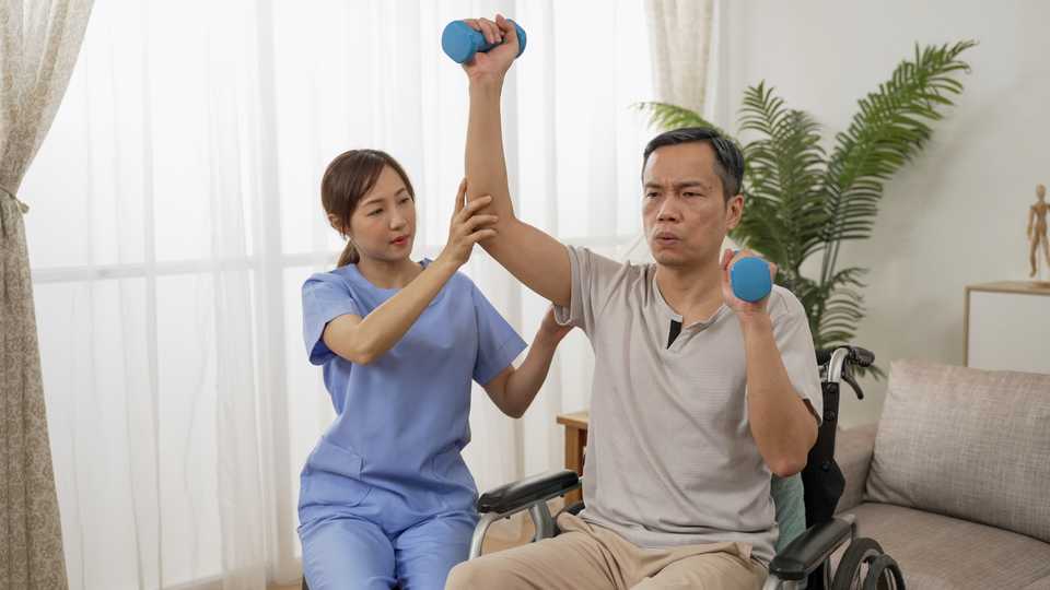 Man with disability undergoing rehabilitation and therapy