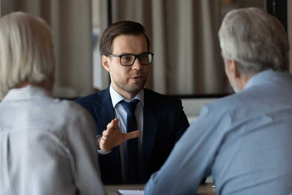 Doctor speaking to his lawyer regarding a medical malpractice case