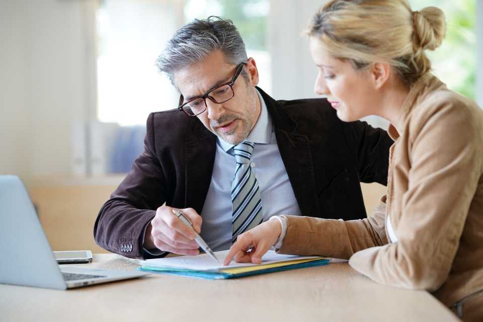 female client consulting a solicitor